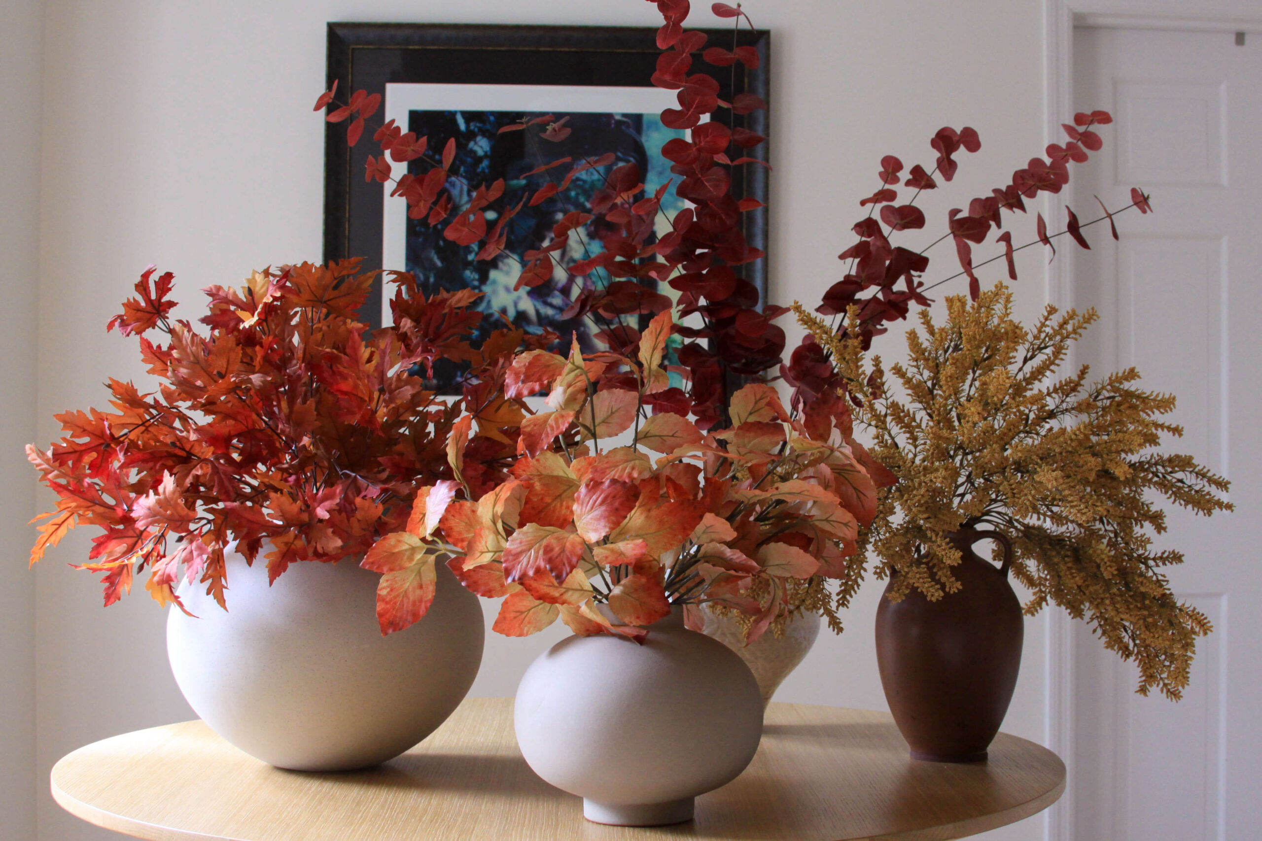 click for how to arrange fall faux stems in different vases