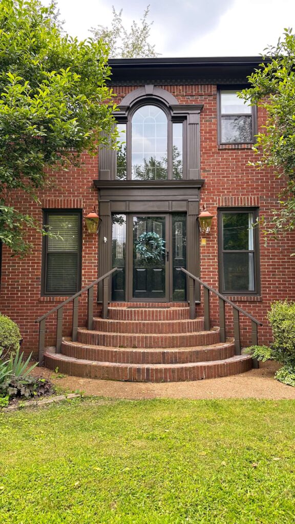 new copper lanterns flanking the front door