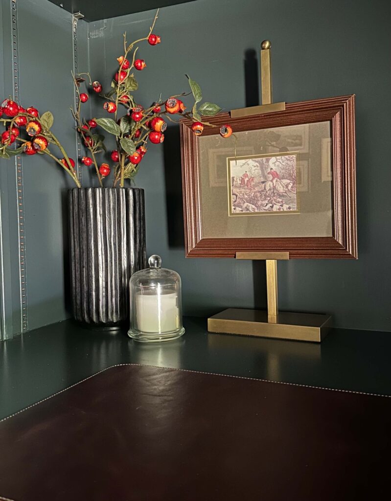 click for tips on how to style long bookshelves. like grouping items in threes.