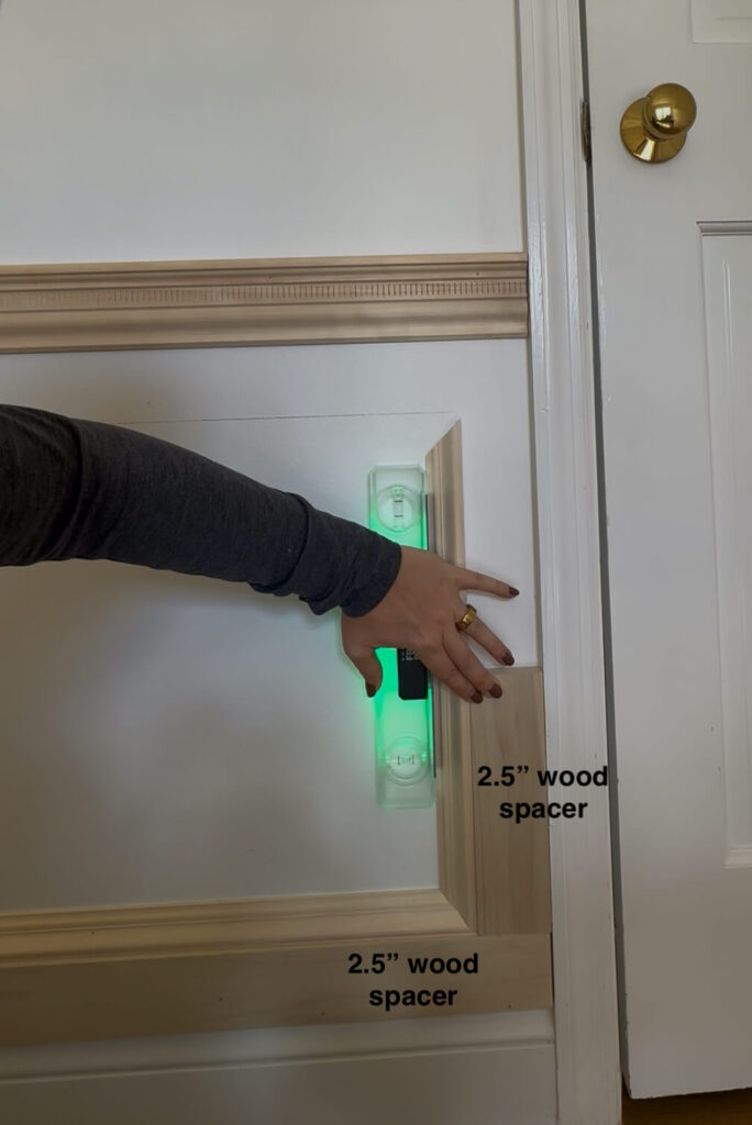 how to design picture frame molding using even spacing around all boxes with a wood spacer and laser level